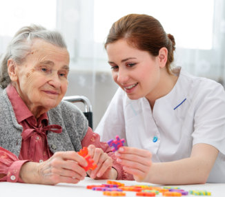 an elderly woman with a caregiver woman