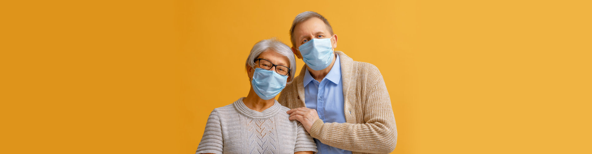 Senior couple wearing facemask during coronavirus and flu outbreak